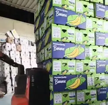A loaded pallet moved by hand truck